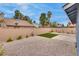 Private backyard featuring desert landscaping, artificial turf, and a concrete patio at 4205 Caliper Dr, Las Vegas, NV 89110