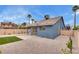Private backyard featuring desert landscaping, artificial turf, and a concrete patio at 4205 Caliper Dr, Las Vegas, NV 89110