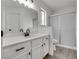 Bright bathroom with white cabinets, modern fixtures, and a glass-enclosed shower at 4205 Caliper Dr, Las Vegas, NV 89110