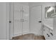 Bathroom features white cabinets, modern fixtures, and built-in linen storage at 4205 Caliper Dr, Las Vegas, NV 89110