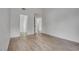 Spacious bedroom with wood-look tile floors, neutral paint, and adjoining room at 4205 Caliper Dr, Las Vegas, NV 89110