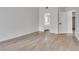 Spacious bedroom with wood-look tile floors and ensuite bathroom at 4205 Caliper Dr, Las Vegas, NV 89110