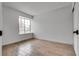 A bright bedroom featuring stylish flooring and a well-lit window at 4205 Caliper Dr, Las Vegas, NV 89110