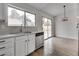 A well-equipped kitchen with stainless steel dishwasher and a view to the outdoor area at 4205 Caliper Dr, Las Vegas, NV 89110