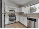 Bright kitchen featuring stainless steel appliances, modern sink, and updated countertops at 4205 Caliper Dr, Las Vegas, NV 89110