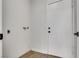 Well-lit laundry room features hookups, tile floors, and access door for added convenience at 4205 Caliper Dr, Las Vegas, NV 89110