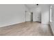 Bright living room with wood-look tile floors, vaulted ceilings, and natural light at 4205 Caliper Dr, Las Vegas, NV 89110