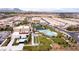 Aerial view of neighborhood, with a pool, recreation area and desert landscape in the distance at 4289 Sunrise Flats St, Las Vegas, NV 89135