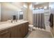 Elegant bathroom featuring a vanity, modern fixtures, and a shower with a curtain at 4289 Sunrise Flats St, Las Vegas, NV 89135