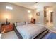 Neutral bedroom with ample lighting, soft carpet and access to the en suite bath at 4289 Sunrise Flats St, Las Vegas, NV 89135