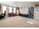 Bonus room with neutral walls, carpet flooring, and a row of black-framed pictures at 4289 Sunrise Flats St, Las Vegas, NV 89135