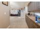 Large bonus room featuring modern cabinets with sink and a carpeted seating area at 4289 Sunrise Flats St, Las Vegas, NV 89135
