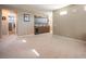 Spacious carpeted bonus room with modern wet bar, wine cooler, and a bathroom entrance at 4289 Sunrise Flats St, Las Vegas, NV 89135