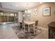 Open dining area with sliding glass doors to the patio, tile flooring, and stylish décor at 4289 Sunrise Flats St, Las Vegas, NV 89135