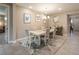 Bright dining room with modern light fixture and tile flooring at 4289 Sunrise Flats St, Las Vegas, NV 89135
