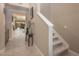 Inviting foyer with staircase, neutral tones, and views of the outdoor patio at 4289 Sunrise Flats St, Las Vegas, NV 89135