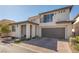Modern two-story home with a brick driveway and attached two-car garage at 4289 Sunrise Flats St, Las Vegas, NV 89135