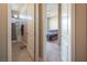 Hallway view showcasing bathroom with shower/tub combo and bedroom with a bed at 4289 Sunrise Flats St, Las Vegas, NV 89135
