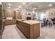 Modern kitchen with a large island, stainless steel appliances, and tile flooring at 4289 Sunrise Flats St, Las Vegas, NV 89135