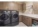 Spacious laundry room with modern washer and dryer, and counter space at 4289 Sunrise Flats St, Las Vegas, NV 89135