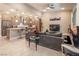 Open-concept living room showcasing the kitchen, comfortable seating, and contemporary decor at 4289 Sunrise Flats St, Las Vegas, NV 89135