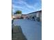 Spacious backyard featuring concrete, a large utility building and privacy fencing at 4626 Sacks Dr, Las Vegas, NV 89122