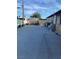 Spacious backyard featuring concrete, a large utility building and privacy fencing at 4626 Sacks Dr, Las Vegas, NV 89122