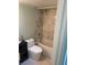 Bathroom featuring white tile shower-tub combo with gray veining at 4626 Sacks Dr, Las Vegas, NV 89122