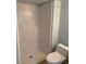 White subway tiled standing shower with adjacent toilet at 4626 Sacks Dr, Las Vegas, NV 89122