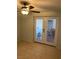 Bedroom with tiled floor, ceiling fan, and glass paneled doors at 4626 Sacks Dr, Las Vegas, NV 89122