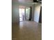 Bedroom with sliding glass doors, tiled floor, and closet at 4626 Sacks Dr, Las Vegas, NV 89122