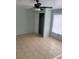 Bedroom with tile floors, closet, and sheer curtains at 4626 Sacks Dr, Las Vegas, NV 89122