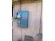 Exterior view of the home's utility connections and gray stucco siding at 4626 Sacks Dr, Las Vegas, NV 89122