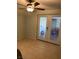 Neutral room with a ceiling fan and patio doors for easy access to the outdoors at 4626 Sacks Dr, Las Vegas, NV 89122