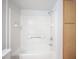 Bright bathroom shower and tub with white tiling and chrome fixtures at 5055 W Hacienda Ave # 2125, Las Vegas, NV 89118