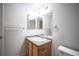 Bathroom featuring a single sink vanity, granite countertops, and modern lighting at 5055 W Hacienda Ave # 2125, Las Vegas, NV 89118