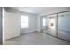 Well-lit bedroom featuring sliding mirror closet doors and light wood flooring at 5055 W Hacienda Ave # 2125, Las Vegas, NV 89118