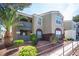 Condominium exterior showcasing the building number, balcony and colorful accents at 5055 W Hacienda Ave # 2125, Las Vegas, NV 89118