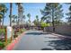 View of the community entrance with a gate and landscaping at 5055 W Hacienda Ave # 2125, Las Vegas, NV 89118