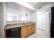 Well-lit kitchen with a granite countertop pass-through to the spacious living area at 5055 W Hacienda Ave # 2125, Las Vegas, NV 89118