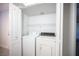 A laundry room featuring a washer and dryer behind closet doors at 5055 W Hacienda Ave # 2125, Las Vegas, NV 89118