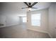 Bright, open-concept room featuring wood-look floors and a view to the windows at 5055 W Hacienda Ave # 2125, Las Vegas, NV 89118
