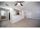 Open living room view featuring wood-look floors with views to the kitchen and bathroom at 5055 W Hacienda Ave # 2125, Las Vegas, NV 89118