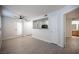 Open living room featuring wood-look flooring, access to a balcony, and a view of the kitchen at 5055 W Hacienda Ave # 2125, Las Vegas, NV 89118