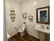 Charming powder room with decorative signs and rustic accents at 600 N Carriage Hill Dr # 1082, Las Vegas, NV 89138