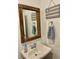 Half bathroom with wooden mirror and star decor at 600 N Carriage Hill Dr # 1082, Las Vegas, NV 89138