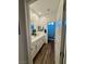 Bathroom showcasing a double vanity, modern lighting, and a doorway leading to toilet and shower at 600 N Carriage Hill Dr # 1082, Las Vegas, NV 89138