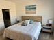 Bright bedroom featuring a wooden headboard, soft lighting, and a calming beach-themed art piece at 600 N Carriage Hill Dr # 1082, Las Vegas, NV 89138