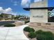 Landscaped community entrance with a modern sign and well-maintained grounds at 600 N Carriage Hill Dr # 1082, Las Vegas, NV 89138