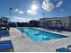 A refreshing community pool with lounge chairs for relaxation and enjoyment at 600 N Carriage Hill Dr # 1082, Las Vegas, NV 89138